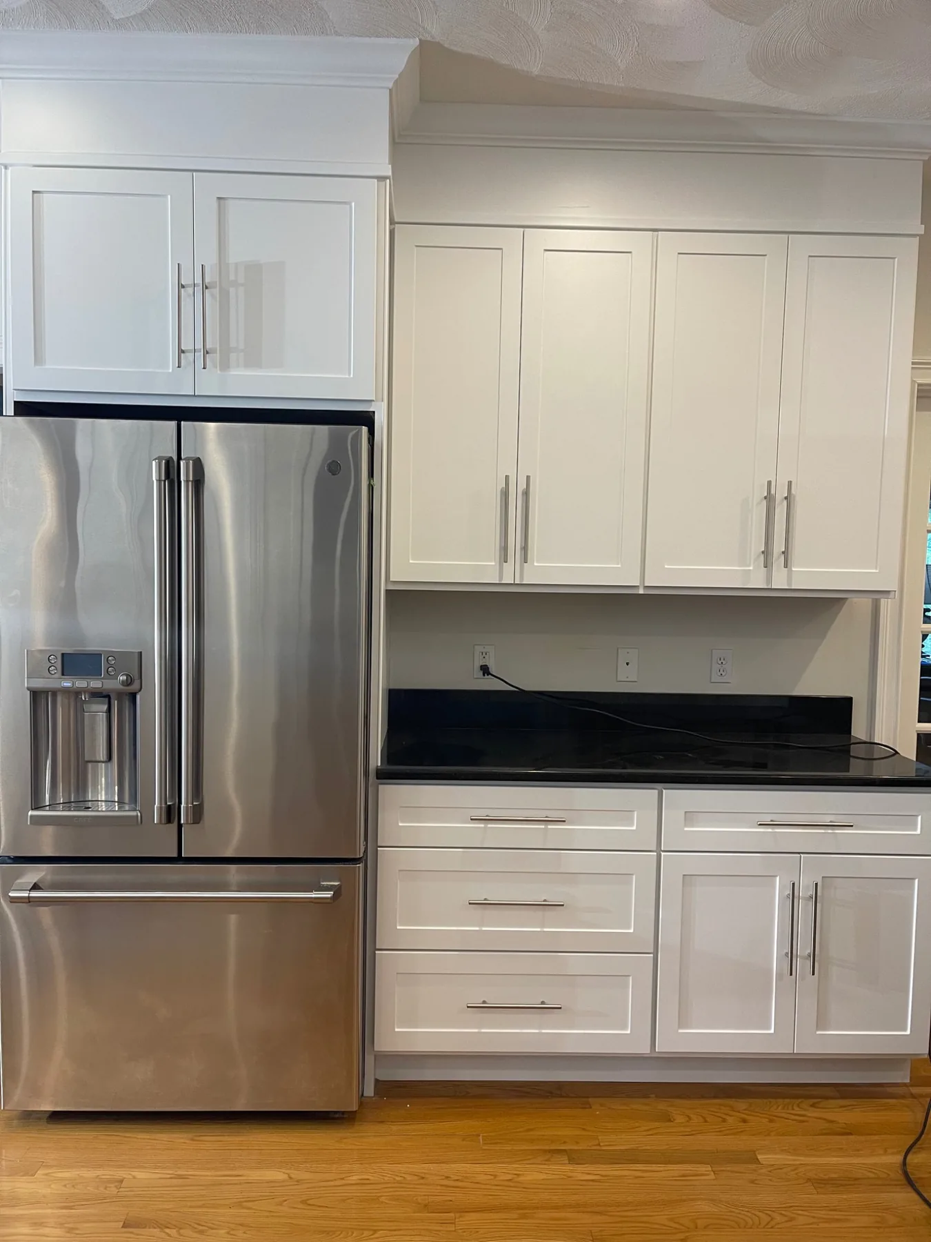 Bright white shaker kitchen cabinet refacing project in Wilmington Massachusetts